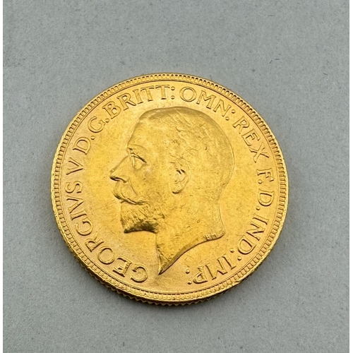 974 - Coins: Coins: A King George V full sovereign dated 1930, circulated, in hard display case.... 