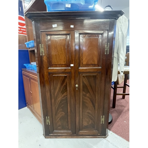 1 - Furniture: George III mahogany wall mounted corner cupboard twin panelled door opens to reveal shape... 