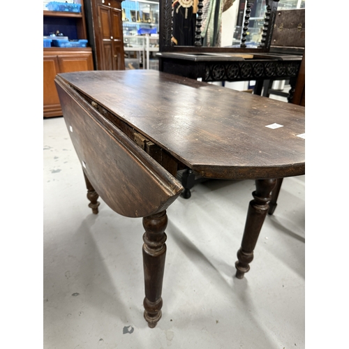 118 - Furniture: Oval table, late 19th century of pine construction throughout. On turned legs, winged sid... 