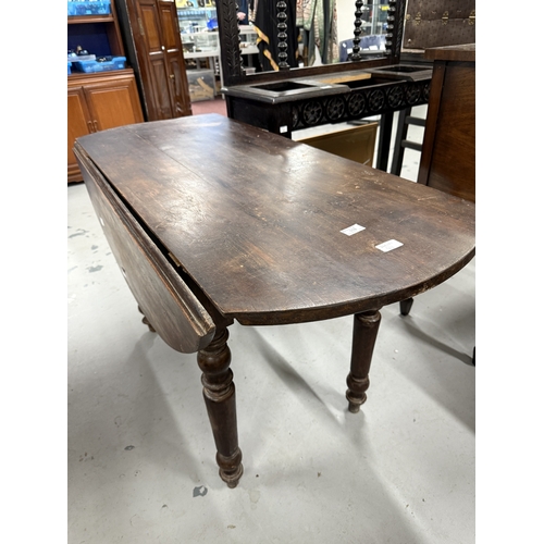 118 - Furniture: Oval table, late 19th century of pine construction throughout. On turned legs, winged sid... 