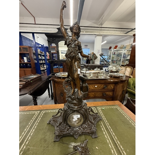 126 - Clocks: Late 19th century French Spelter clock female figure with hammer and anvil replacement clock... 