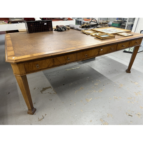 202 - Furniture: 20th Century light mahogany boardroom table with brown leather skiver on chamfered suppor... 