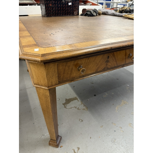 202 - Furniture: 20th Century light mahogany boardroom table with brown leather skiver on chamfered suppor... 