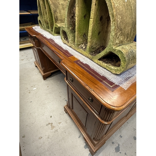 208 - Desk: 20th-century mahogany double pedestal full-faced partner desk. Single drawer over doors with l... 