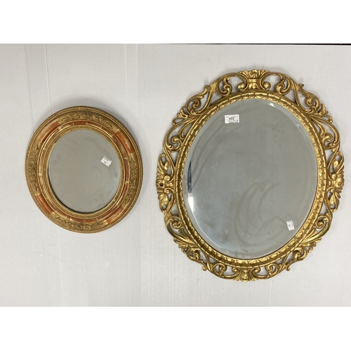 224 - Mirrors: Late 19th century giltwood carved scroll framed oval mirror with bevelled edge, 63cm x 56cm... 