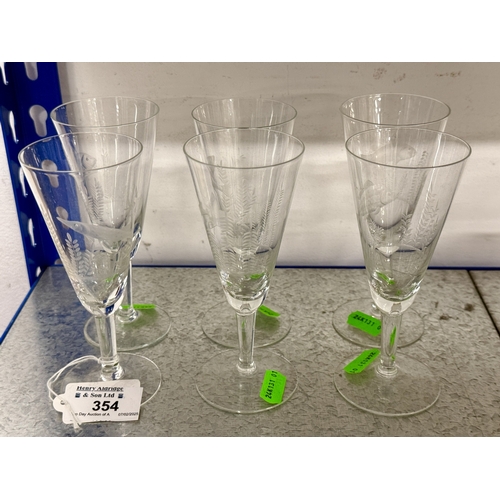 354 - Glassware: A set of six tapering wine or aperitif glasses, each engraved with a different game fish ... 