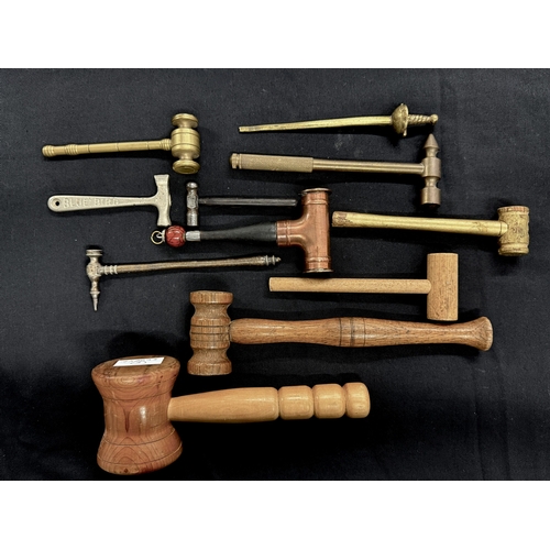 362 - Treen: Four auctioneer gavels of varying sizes, a brass example, a copper one with Victorian pennies... 