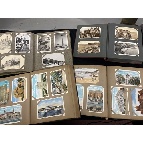 368 - Postcards: Postcards, four albums of Edwardian and later cards. The two larger contain Canadian, Jap... 