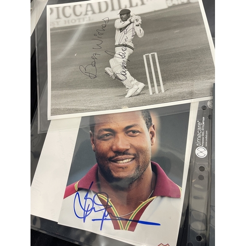 402 - Sporting Autographs: A collection of signed photographs bearing the signatures from the world of Cri... 