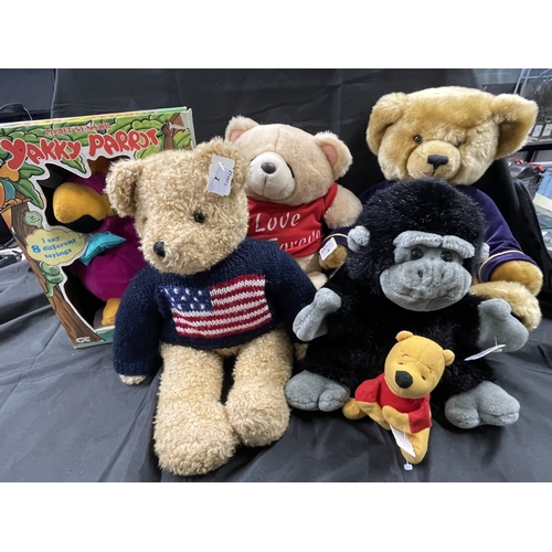 485 - Toys: A Harrods 2000 teddy bear, an Andrew Brownsword plush bear, a Yakky parrot boxed, a gorilla an... 