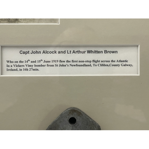 536 - Aviation: Framed postcard of Alcock & Brown with both signatures on the rear and a metal object ... 