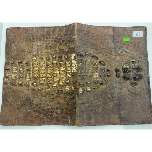 556 - Taxidermy: A crocodile skin music folio, three inner pouches, 36cm by 26cm closed.... 