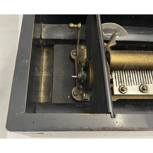 558a - Music: A simulated rosewood 10-air Swiss music box. No visible marks. The comb and cylinder are inta... 