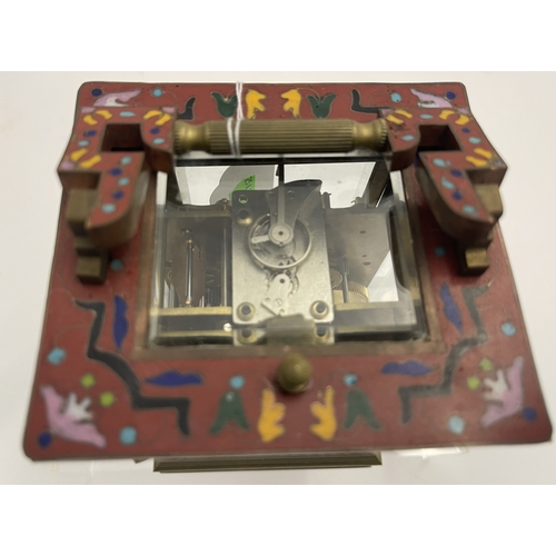 560 - Clocks: A Chinese reproduction cloisonne enamelled repeating four glass carriage clock, of square fo... 