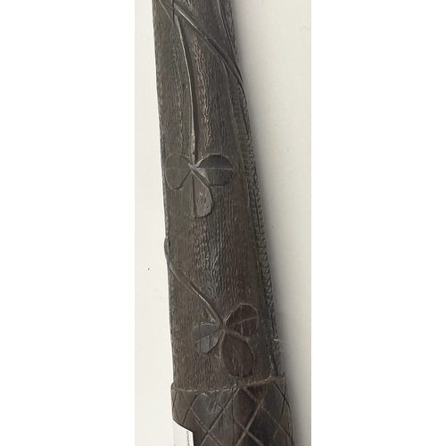 600 - Treen: A 19th century Irish carved oak Parish constables truncheon, carved all over in typical fashi... 