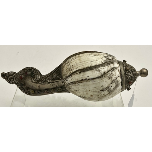 603 - Oriental: A Tibetan style dung dkar or ritual trumpet, a conch shell mounted in silver and inset wit... 