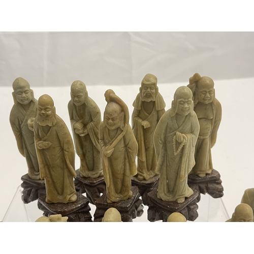 604 - Oriental: A set of carved soapstone figures depicting the eighteen Buddhist Arhats, each around 12cm... 