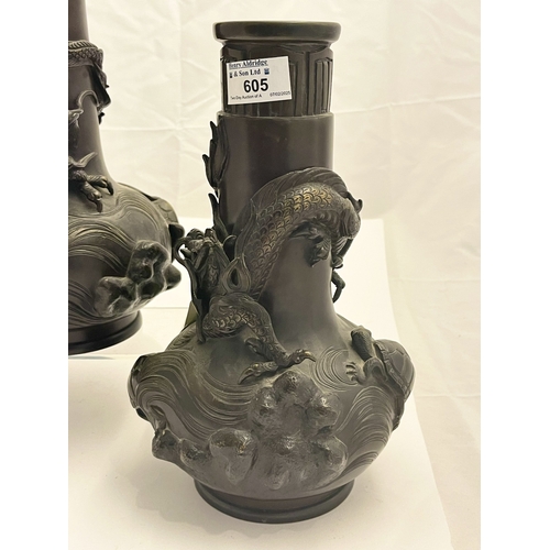 605 - Oriental: A pair of Japanese late Meiji bronze bottle style vases, the oval body cast with turtles a... 