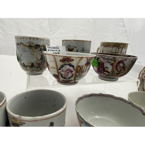 607 - Oriental: Four Chinese figural painted famille rose tea bowls, a single saucer, and five similarly d... 