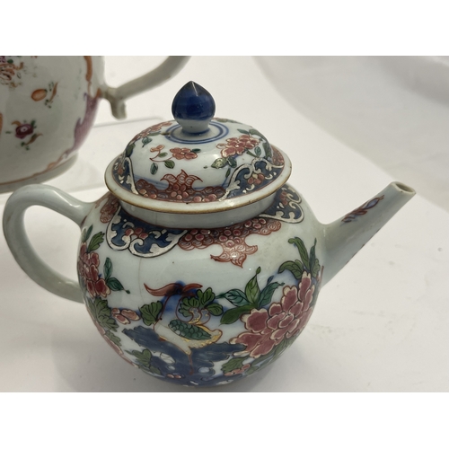 612 - Oriental: A Chinese export famille rose bullet teapot, 18cm long, another enamelled with birds among... 