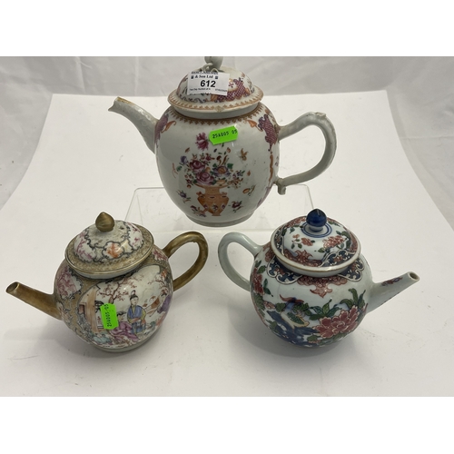 612 - Oriental: A Chinese export famille rose bullet teapot, 18cm long, another enamelled with birds among... 