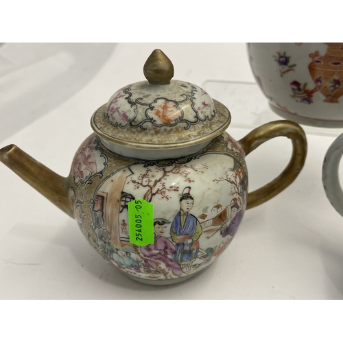 612 - Oriental: A Chinese export famille rose bullet teapot, 18cm long, another enamelled with birds among... 