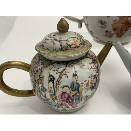 612 - Oriental: A Chinese export famille rose bullet teapot, 18cm long, another enamelled with birds among... 