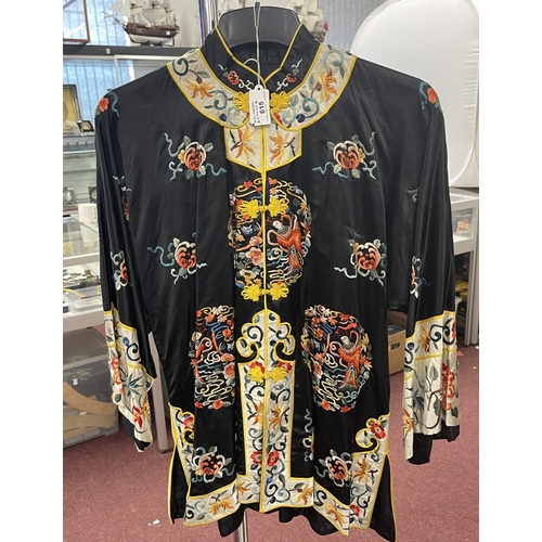 615 - Fashion: c1950s Chinese black silk long-sleeve jacket, heavily embroidered with panels.