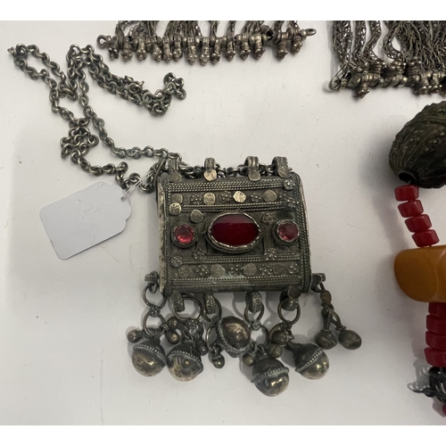 623 - Tribal Bedouin - Saudi: Box amulet and neck chain set with pink & red glass with five bells plus... 