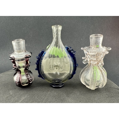 668 - Glassware: Three Continental glass scent bottles, late 18th century, one of flattened pear-shape app... 