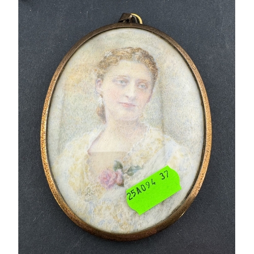 669 - Decorative Arts: A 19th century portrait miniature on ivory of a young girl in white dress with blue... 