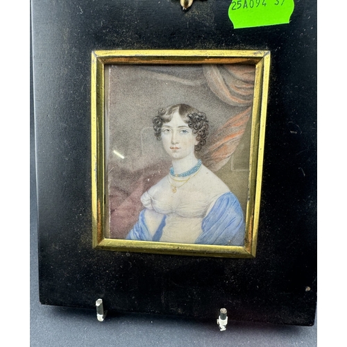 669 - Decorative Arts: A 19th century portrait miniature on ivory of a young girl in white dress with blue... 