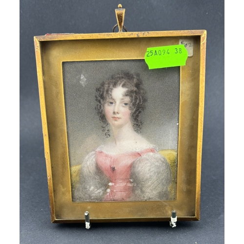 670 - Decorative Arts: A portrait miniature on ivory of a young girl in pink dress, dated 1830, within squ... 