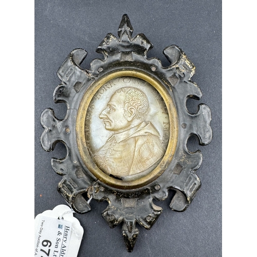 674 - Decorative Arts: a 17th century carved mother of pearl portrait of St Charles Borromeo, cardinal, ar... 