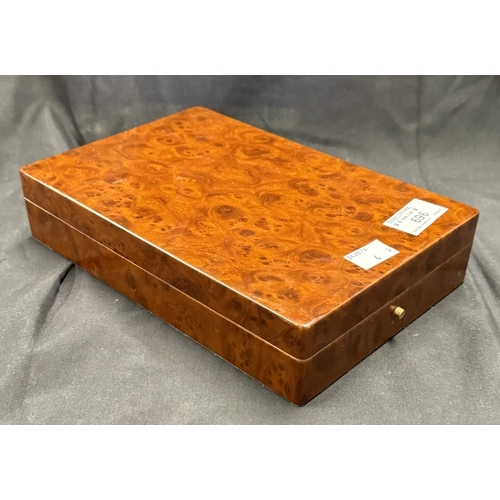 696 - Smoking Requisites: A burr walnut veneered humidor with Claridges coat of arms printed to the unders... 