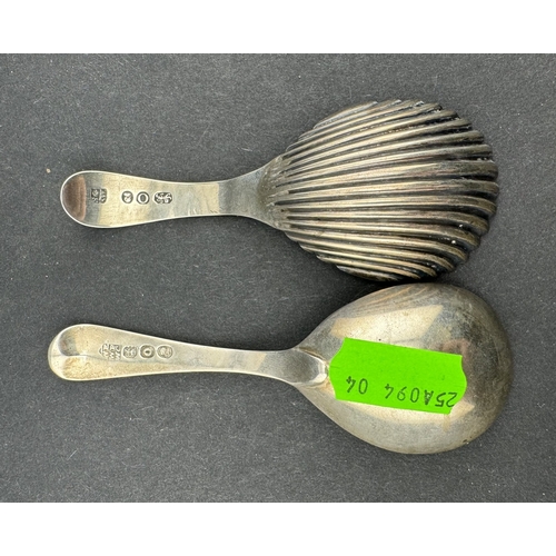 828 - Silver: An Old English pattern caddy spoon, London 1811, together with a shell pattern caddy spoon, ... 