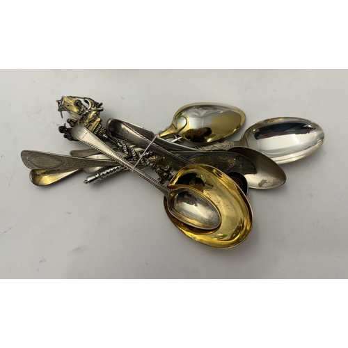 832 - Silver: A silver gilt spoon, import marks for London 1898, the terminal cast as three men in a boat;... 