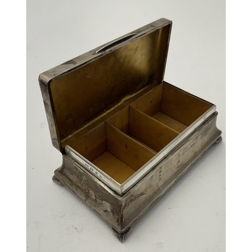 834 - Silver: A large silver three section cigarette box of casket form, London 1929, presentation inscrip... 