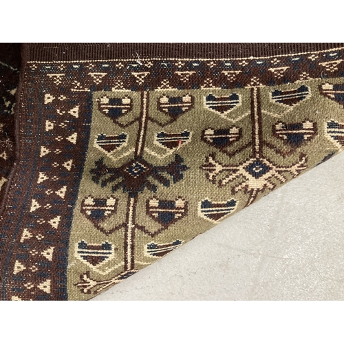 88 - Carpets/Rugs: Turkoman rug. Rich dark hues refreshed with white motifs and swirls, possible tent doo... 