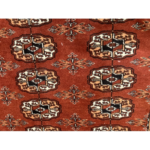 90 - Carpets/Rugs: Telke Bokhara red ground with 3 rows of 51 oval motifs widespread with geometric shape... 