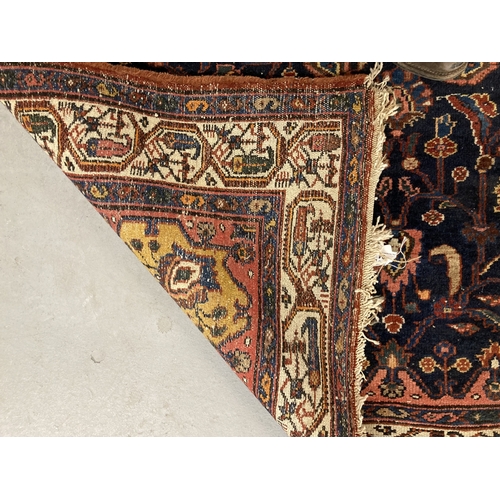 94 - Rugs & Carpets:  Savouk Persian carpet 20-30 years old, machine woven wool carpet, blue ground 2... 