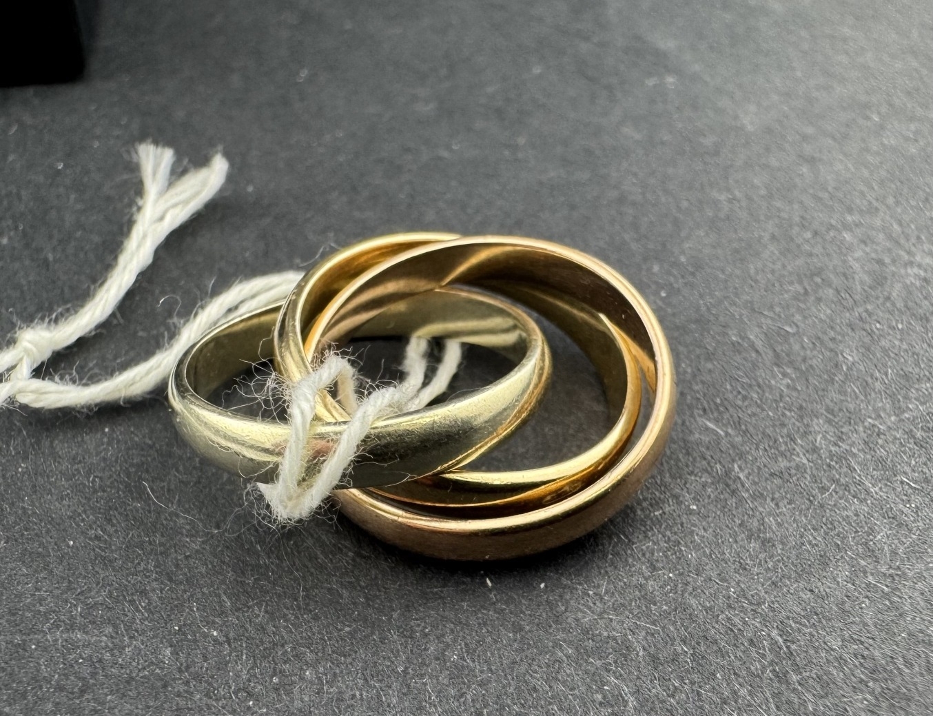 Jewellery: A 9ct gold puzzle ring in a Russian style, three interlinked ...