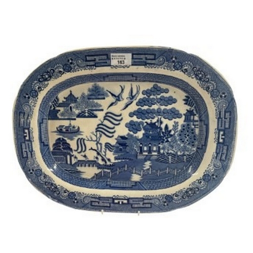 Ceramics A large blue and white transferware charger, printed with the ...