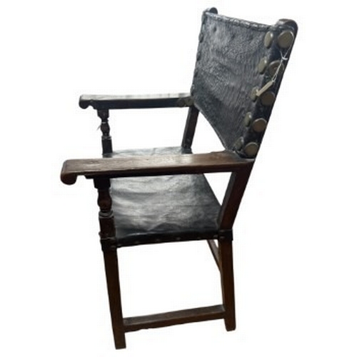 2 - Furniture: an 18th century Baroque monk's chair or sillon de frailero. a leather seat and backrest o... 