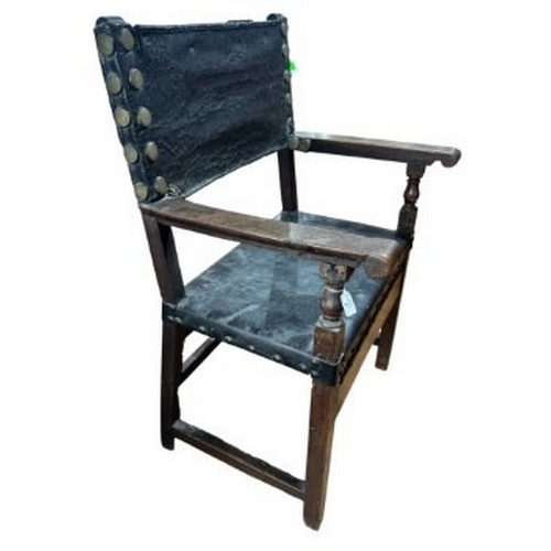 2 - Furniture: an 18th century Baroque monk's chair or sillon de frailero. a leather seat and backrest o... 