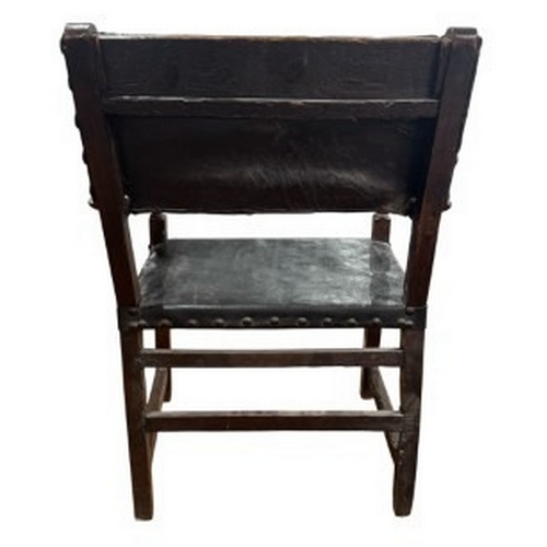 2 - Furniture: an 18th century Baroque monk's chair or sillon de frailero. a leather seat and backrest o... 
