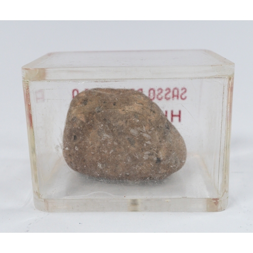 38a - Social History: an Italian perspex cased stone sample from Hiroshima, taken after the 1945 atomic bo... 