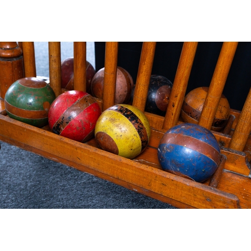 9 - Gardenalia: an early 20th century beech and ash croquet set and stand, the mallets marked for G.Spar... 
