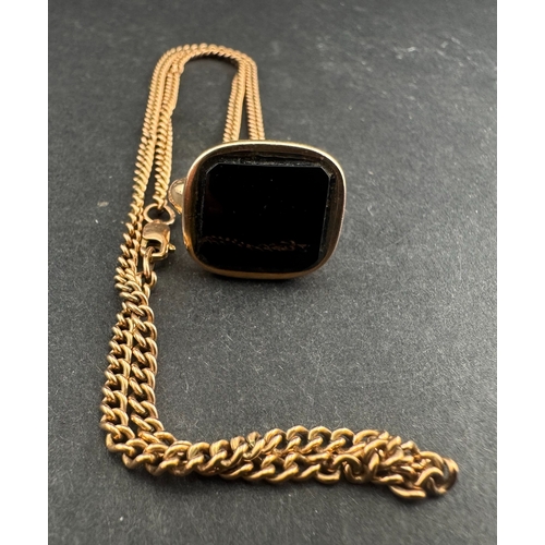 473 - Jewellery: a gold cased fob seal with unengraved onyx table, 6.6g, togther with a 47cm 9ct gold curb... 