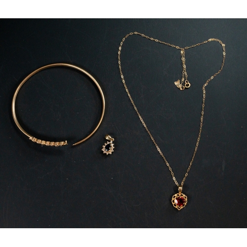 529 - Jewellery: a 9ct gold bangle, set with four sapphires and three diamonds, a 9ct gold necklace and a ... 